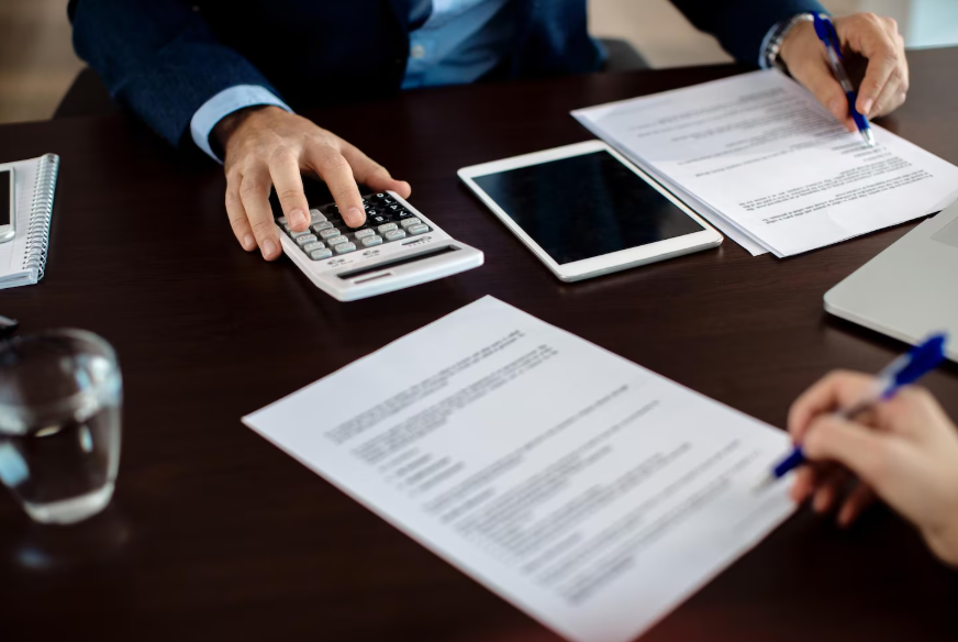 Reviewing loan terms and calculator while deciding are credit builder loans worth it