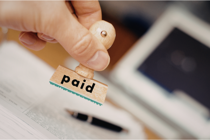 Paid stamp illustrating decision to settle debt or pay in full