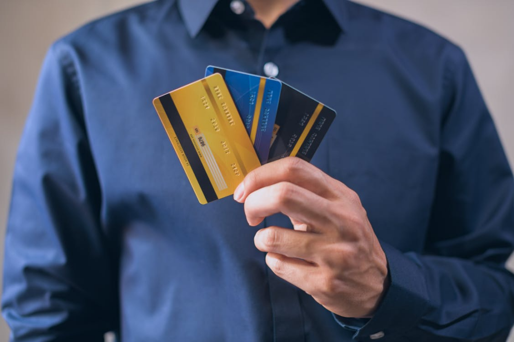 Person holding multiple credit cards while deciding if you should open multiple credit cards at once